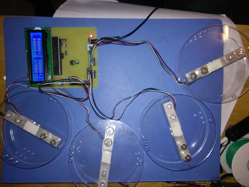 基于51单片机的平面受力定位系统设计-LCD1602-HX711-（源码+电路图）_百工联_工业互联网技术服务平台